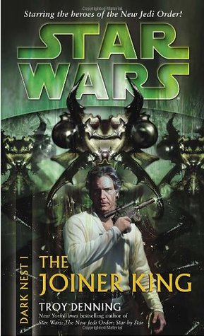 han solo standing in front of a giant bug on a green background while holding a blaster