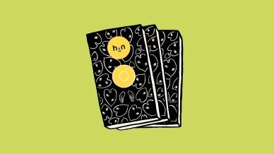 three black books with leaves that have eyes outlined in white patterned on it and a pair of hands. In the center of the top book there's a yellow circle with "hxn" and below that a yellow circle with a white circle inside. The background is bright green